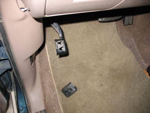 1995 Ford C-350 (Centurion Conversions) - The pedal assembly is broken and detached from its mounting bracket inside the vehicle's interior.