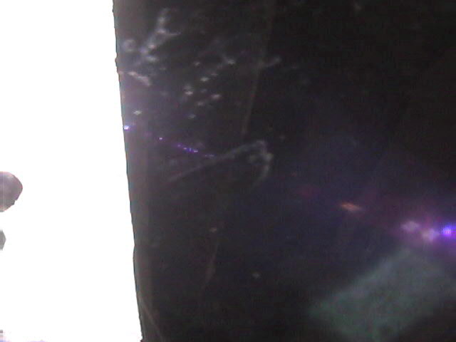 Dark surface with water spots and a Supermotors.net watermark