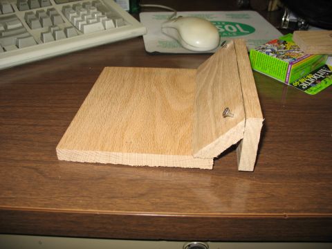 1995 Ford C-350 (Centurion Conversions) - A wooden object is on a desk, with a keyboard and mouse visible in the background.