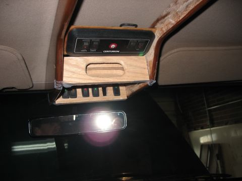 1995 Ford C-350 (Centurion Conversions) - Custom overhead console with auxiliary switches and a Centurion label.