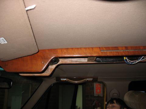 1995 Ford C-350 (Centurion Conversions) - Interior view of the overhead console area, showing wood trim and visible wiring.