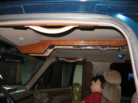 1995 Ford C-350 (Centurion Conversions) - The overhead console of a 1995 Ford C-350 Centurion Conversions shows wood trim and exposed wiring.