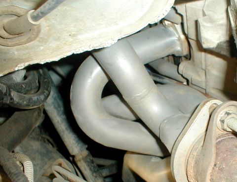 1996 Ford Bronco - Exhaust manifold pipes and connections are visible in this close-up view.