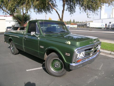 1996 Ford Bronco - This green 1967 GMC pickup truck features a distinctive grille and chrome bumper.