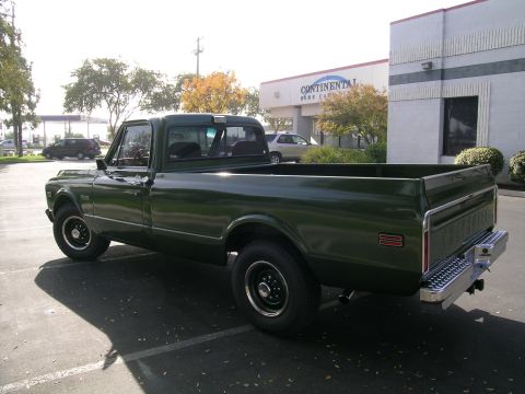1996 Ford Bronco - This dark green 1971 Chevrolet pickup truck is shown from a 3q-front angle.