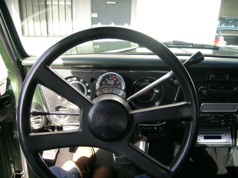 1996 Ford Bronco - Interior view of a GMC vehicle, showing the steering wheel, dashboard, and gauges.