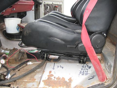1979 Ford F-150 - Interior view of racing seats with measurements marked on the floor.