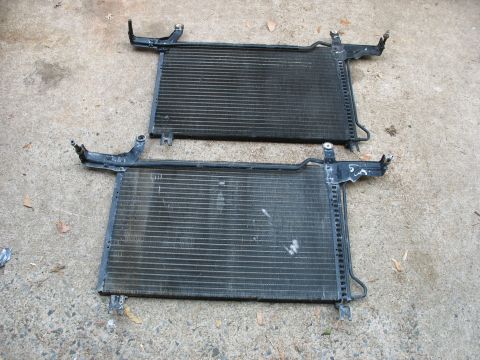 1995 Ford C-350 (Centurion Conversions) - Two automotive radiators are shown side-by-side on a concrete surface.