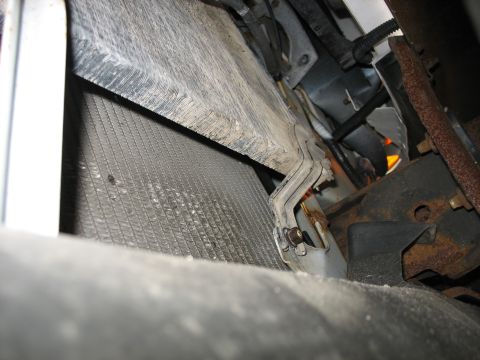 1995 Ford C-350 (Centurion Conversions) - Radiator and mounting bracket detail, likely from the front of a vehicle.