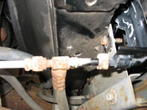 1995 Ford C-350 (Centurion Conversions) - Close-up view of AC condenser lines and hoses, showing signs of rust and wear.