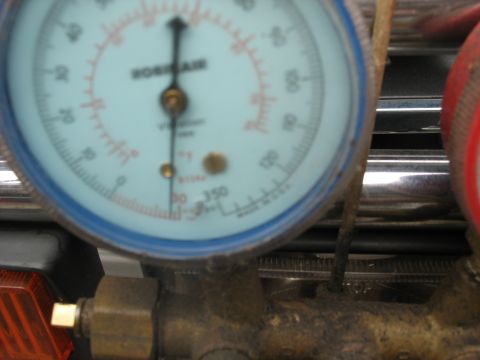 1995 Ford C-350 (Centurion Conversions) - AC manifold gauge set with readings visible, part of a diagnostic tool.