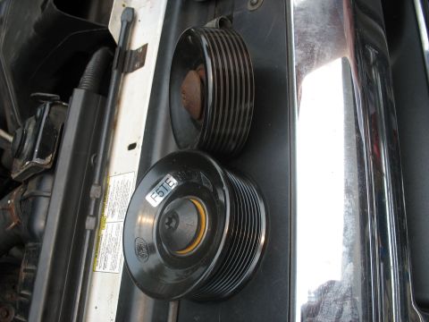 1995 Ford C-350 (Centurion Conversions) - Close-up of an idler pulley, possibly from a Ford vehicle, with a visible F5TE part number.