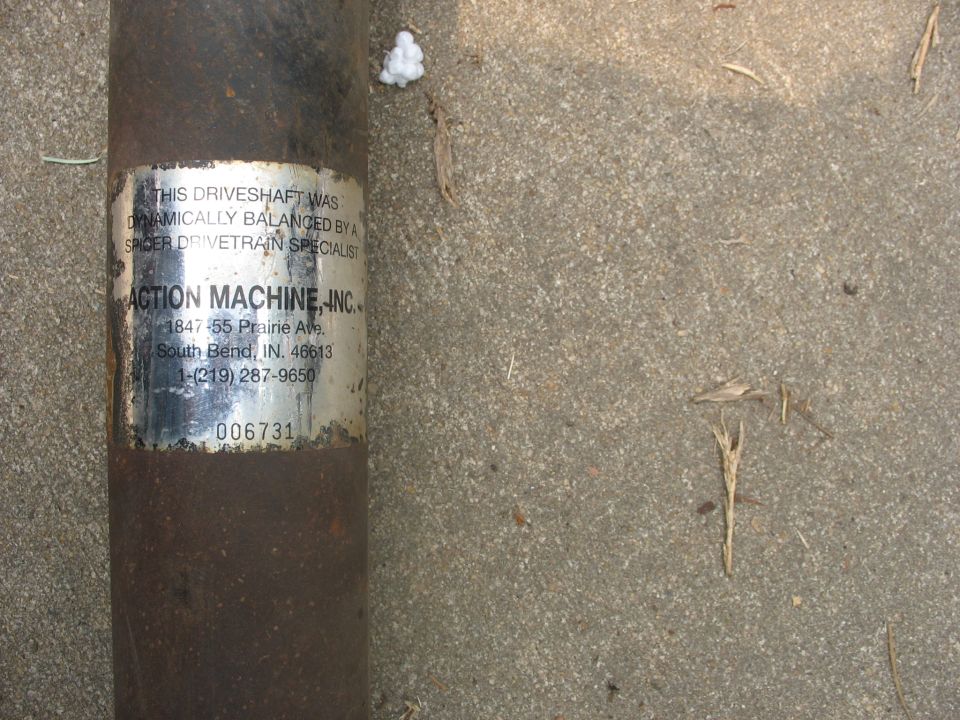 Driveshaft with "Action Machine, Inc." label
