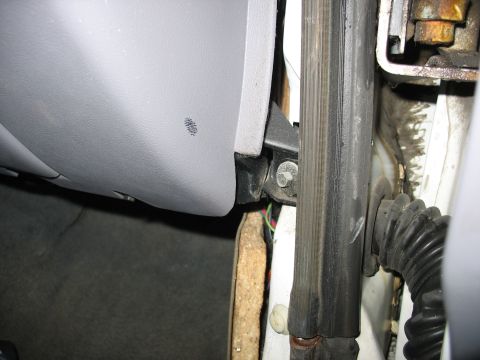 1995 Ford C-350 (Centurion Conversions) - Interior door jamb detail showing rubber seal and wiring harness, likely from a truck or van.