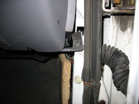 1995 Ford C-350 (Centurion Conversions) - Detail of the interior door jamb area, revealing insulation and wiring harness.