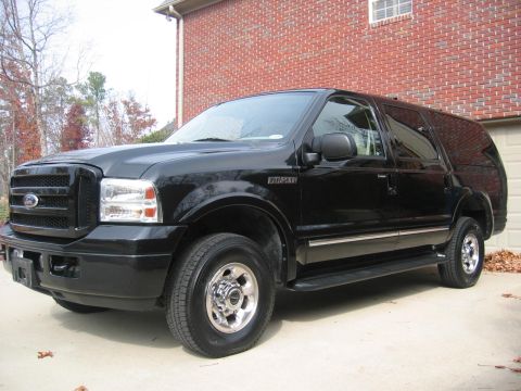 2005 Ford Excursion - This black 2005 Ford Excursion is shown from a 3/4 front angle, parked in a driveway.