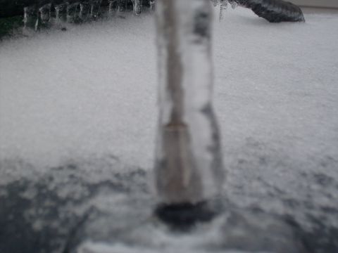 1995 Ford C-350 (Centurion Conversions) - An icicle hangs precariously over a snow-covered surface, hinting at the harsh winter conditions.