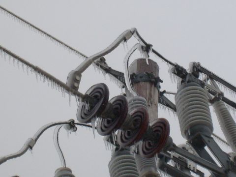 1995 Ford C-350 (Centurion Conversions) - Utility infrastructure encased in ice during a winter storm.