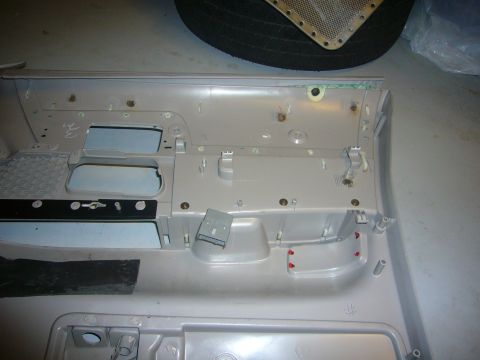 2000 Ford Crown Victoria - The interior of a car door panel is shown, with various mounting points and clips visible.