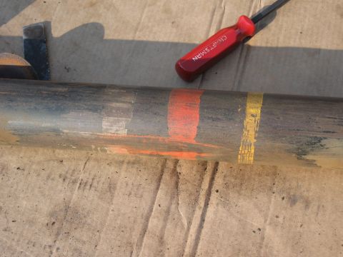 1968 Shelby GT500 - A suspension part with painted identification marks and a Craftsman screwdriver.