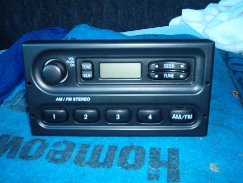 2001 Ford Crown Victoria - This AM/FM stereo radio features numbered preset buttons and a digital display.