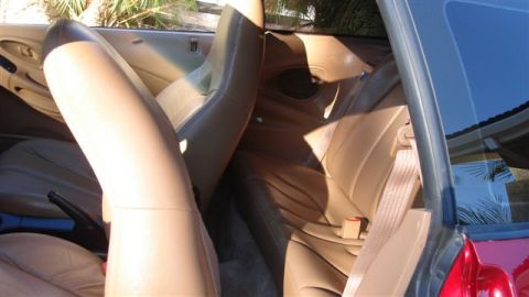 1996 Ford Probe - Interior view of a 1996 Ford Probe, tan upholstery and bucket seats.