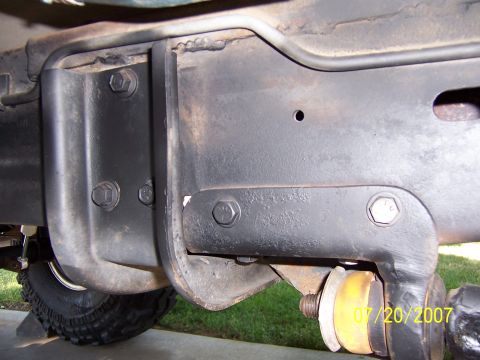 1994 Ford Bronco - This photo shows a close-up view of the undercarriage of a vehicle, focusing on the frame and suspension.