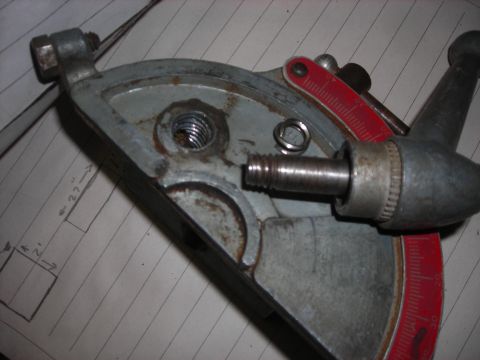 1995 Ford Bronco - This image shows a close-up of a metal shop tool part, a threaded bolt and red measurement markings, with some technical drawings visible i…