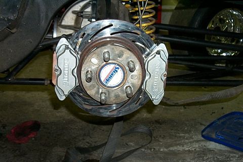 2005 Ford Mustang - Close-up of a vehicle's rear brake system, Strange Engineering components.