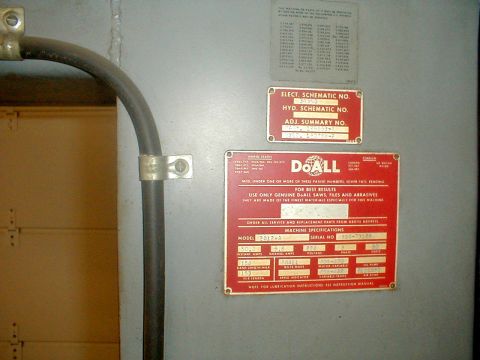 1996 Ford Bronco - Several metal plates with technical information and schematics are attached to a gray wall.