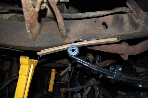 1994 Ford Bronco - A view of the undercarriage of a vehicle, showing suspension components and frame structure.