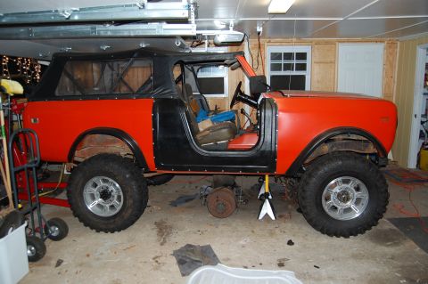 1994 Ford Bronco - This off-road vehicle is in a garage with its front end raised on jack stands.