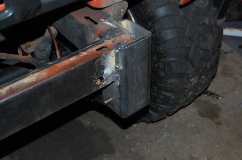 1994 Ford Bronco - Close-up of a custom bumper mount and tire, suggesting off-road modifications.