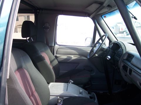 1995 Ford Bronco - Interior view of a 1995 Ford Bronco, highlighting the seats and dashboard.