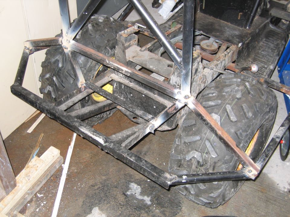 Custom metal frame with large tires, rear view