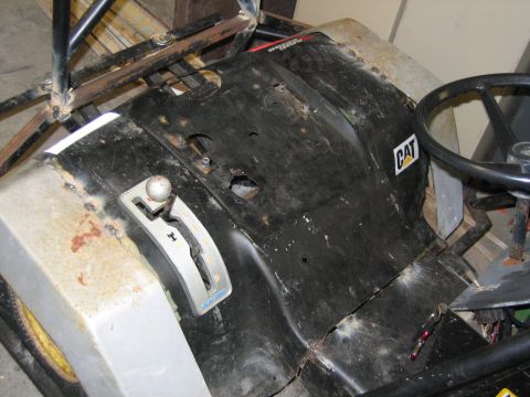 2001 Ford F-150 - The interior of a lawnmower shows a CAT logo and a gear shifter, not a Ford F-150.