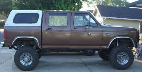 1989 Ford Bronco - This lifted F-250 has a custom camper shell and large off-road tires.