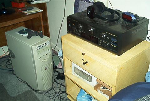 1985 Ford LTD Crown Victoria - Computer and stereo equipment are set up in a room, with a desk and cabinet visible.