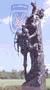 2002 Ford Crown Victoria - Outdoor statue depicts a cowboy on horseback against a backdrop of sky and trees.