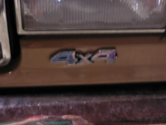 4x4 badge on brown vehicle