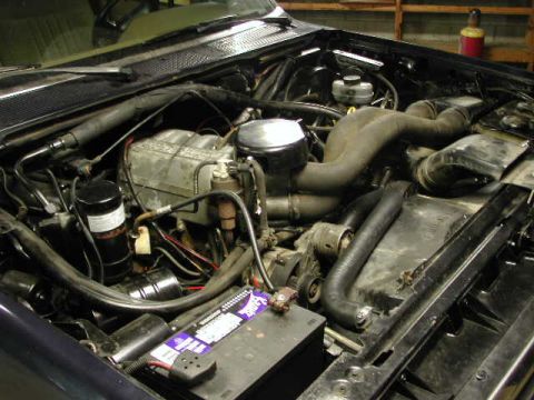1988 Ford F-150 - Close-up view of the engine compartment, showing various mechanical parts and wiring.