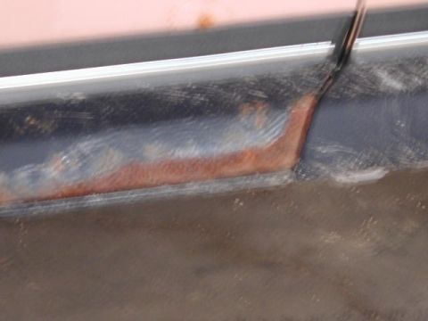 1988 Ford F-150 - The lower body panel of a 1988 Ford F-150 shows significant rust damage.
