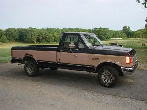 1988 Ford F-150 - Side view of a 1988 Ford F-150 pickup truck with a two-tone paint scheme.