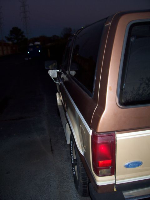 1984 Ford Bronco II - Rear view of a brown 1984 Ford Bronco II, showing its distinctive body style and Ford badging.