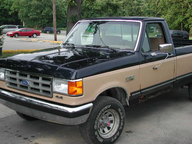 1987 Ford F-150 pickup truck, two-tone black and tan paint, chrome bumper