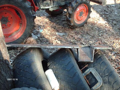 1990 Ford F-150 - Tractor tires and a metal bracket are shown in this outdoor photo, dated December 16, 2007.