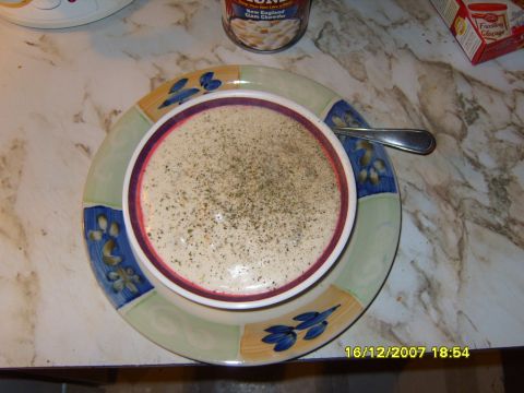 1989 Ford Bronco - A bowl of clam chowder is ready to be eaten, with a can of soup and a box of frosting nearby.