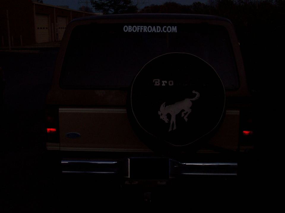 Rear view of a 1984 Ford Bronco II with a spare tire cover the Bronco logo