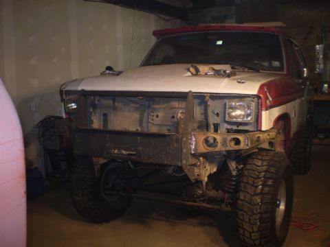 1986 Ford Bronco - This Ford Bronco appears to be undergoing modifications, with its front end partially disassembled.