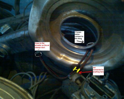 1979 Ford F-150 - Close-up under the hood of a chrome round air cleaner housing with its snorkel inlet and flexible black heat-riser duct, annotated with whi…